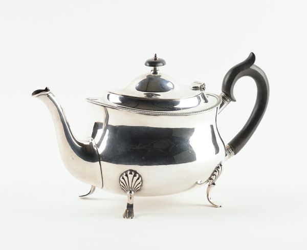 A SILVER TEAPOT