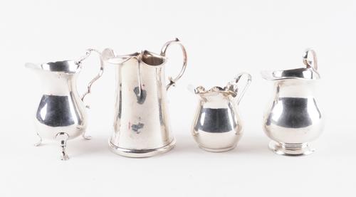 A GROUP OF FOUR SILVER CREAM JUGS (4)