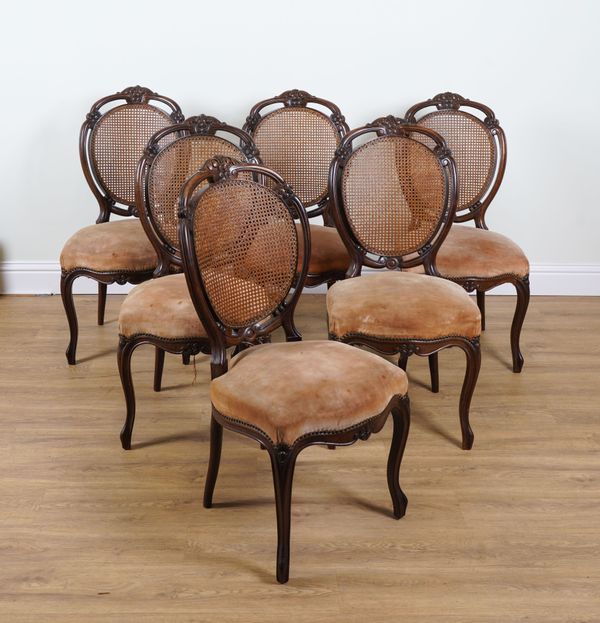 A SET OF SIX LOUIS XV STYLE WALNUT CANE-BACK DINING CHAIRS (6)