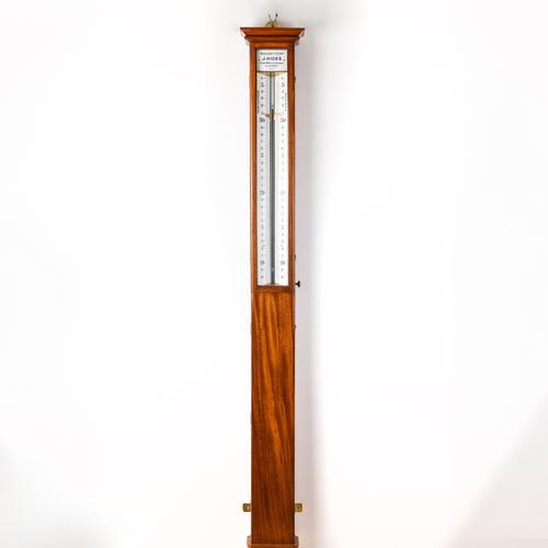 A LARGE MAHOGANY SHOP WINDOW BAROMETER