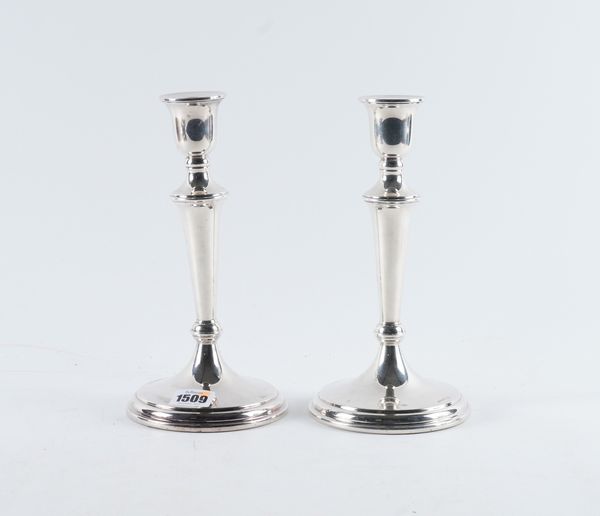 A PAIR OF SILVER TABLE CANDLESTICKS