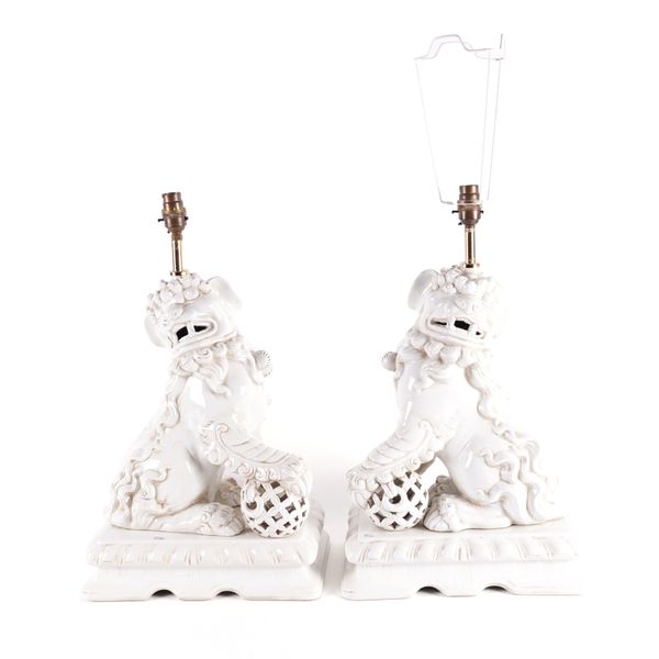 A PAIR OF WHITE GLAZED CERAMIC 'FOO DOG' OR 'BUDDHIST LION' TABLE LAMPS  (2)