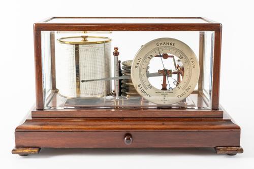 AN EDWARDIAN GLAZED MAHOGANY BAROGRAPH