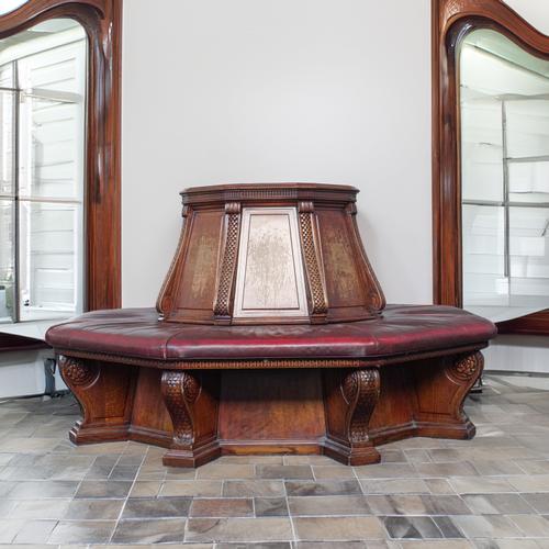A LATE 20TH CENTURY OAK ROUGE LEATHER UPHOLSTERED OCTAGONAL GALLERY BENCH | FROM THE NATIONAL GALLERY, LONDON