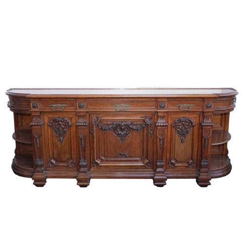 A LARGE 19TH CENTURY CONTINENTAL CARVED WALNUT SIDEBOARD