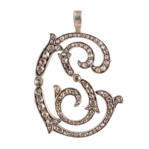 A DIAMOND MONOGRAM PENDANT