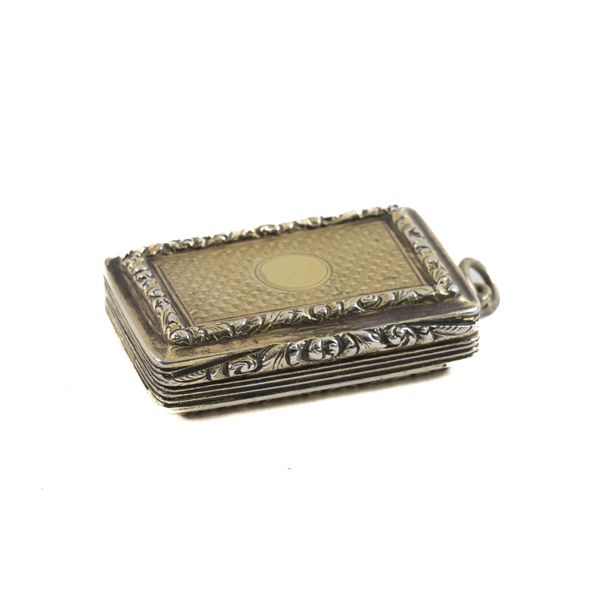 A SILVER GILT RECTANGULAR VINAIGRETTE