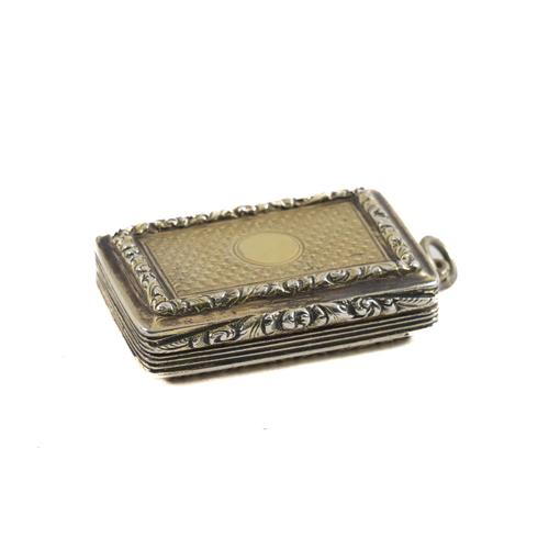 A SILVER GILT RECTANGULAR VINAIGRETTE