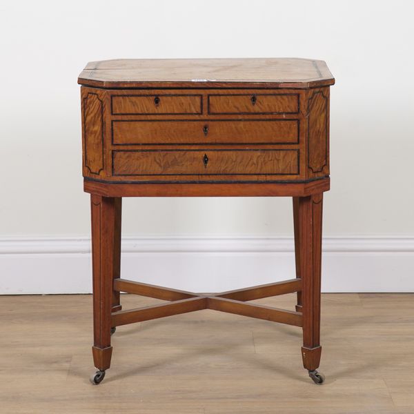 A REGENCY EBONY LINE INLAID SATINWOOD LIFT TOP TEA POY