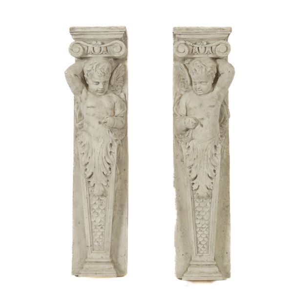 A PAIR OF FAUX STONE CHERUB CARYATID SUPPORTS (2)