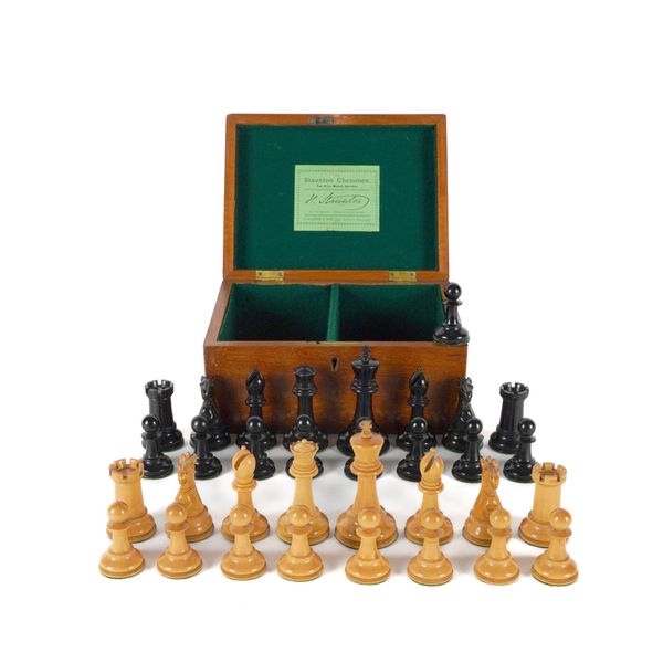 A VICTORIAN JAQUES OF LONDON STAUNTON PATTERN WEIGTHED EBONY AND BOXWOOD CHESS SET (34)