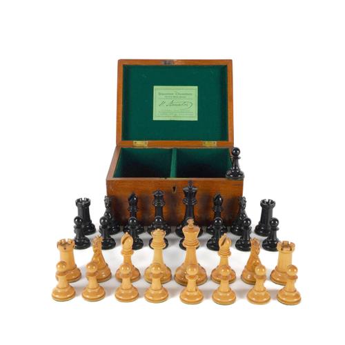 A VICTORIAN JAQUES OF LONDON STAUNTON PATTERN WEIGTHED EBONY AND BOXWOOD CHESS SET (34)