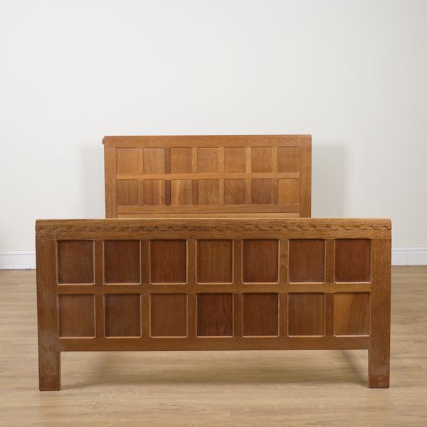 ROBERT MOUSEMAN THOMPSON; A 20TH CENTURY PANELLED OAK BED