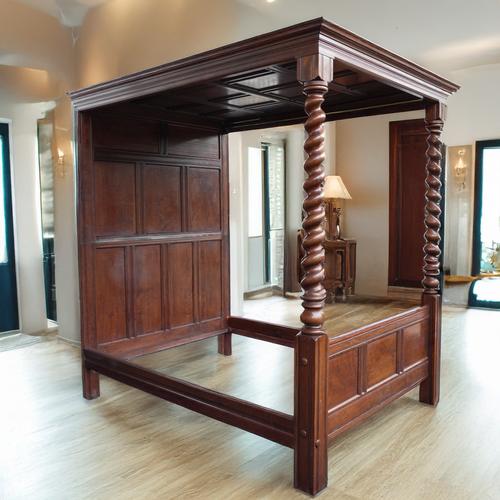 A 17TH CENTURY STYLE STAINED HARDWOOD FOUR POSTER BED
