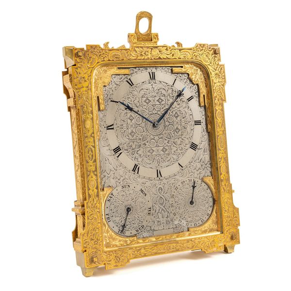 AN ENGRAVED GILT-METAL CALENDAR STRUT EIGHT-DAY TIMEPIECE