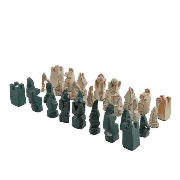 AN ABSTRACT BLUE AND WHITE GLAZE TERRACOTTA CHESS SET (32)