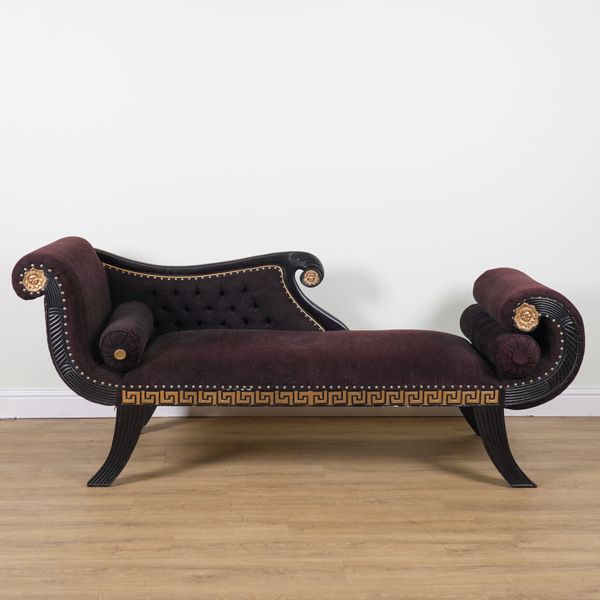 A BLACK PAINTED PARCEL GILT DECORATED CHAISE LONGUE