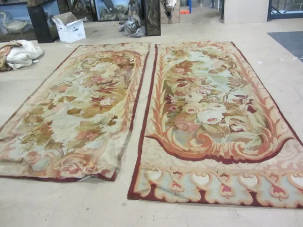 Two Aubusson tapestry panels, each with a bold floral design, 310cm x 133cm. (2)
