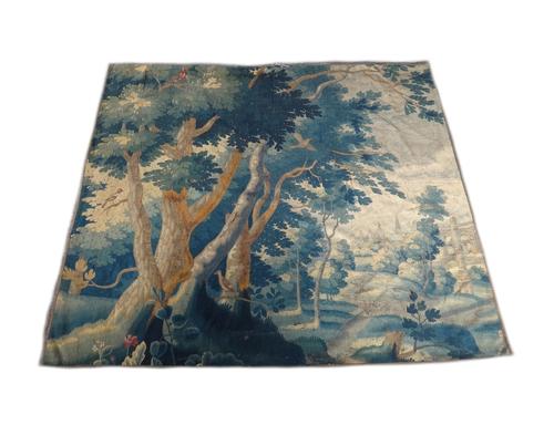 A 17th century verdure Flemish tapestry panel (cut down and re-backed), 239cm x 208cm.   Illustrated