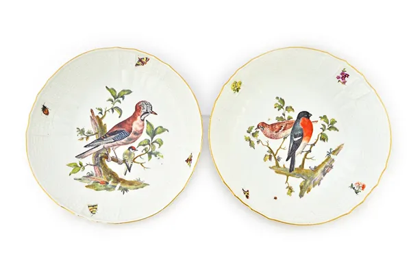 Two Meissen porcelain dishes, mid 18th century, each painted with wild birds within a relief moulded basket weave border, with blue crossed swords mar