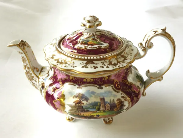 A Ridgway porcelain part tea service, circa 1830-40, painted with landscape vignettes against a maroon ground enriched in gilding, comprising; a teapo