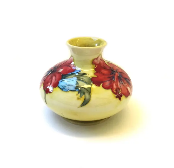 A Moorcroft pottery vase, circa 1930, decorated with an anemone against a yellow ground, with impressed and painted marks, 10cm high.