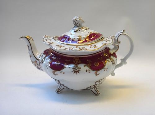 A Ridgway porcelain maroon and gilt part tea and coffee service, circa 1830-40, comprising; a teapot, cover and stand, a sucrier and cover, a milk jug