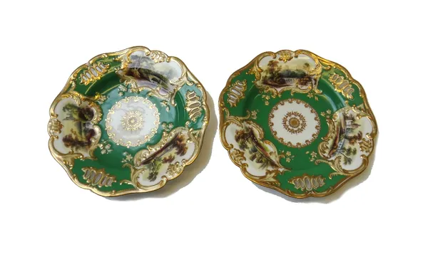 A pair of Minton porcelain green ground pierced plates, 1830's, each painted with three landscape vignettes inside moulded borders, painted pattern 13
