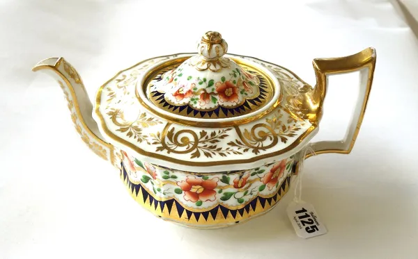 A Ridgway porcelain part tea service, circa 1825, painted with iron red flowers against a deep blue ground and gilt dentil rims, comprising; a teapot,