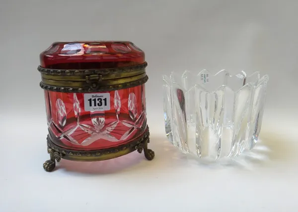 A Continental cranberry flashed glass jar and cover, late 20th century, with metal mounts on three lion paw feet, 17cm high, and an Orrefors style gla