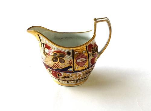 A group of Chamberlain Worcester porcelain, early 19th century, painted with the Japan pattern `240', comprising; a milk jug, three teacups, two sauce