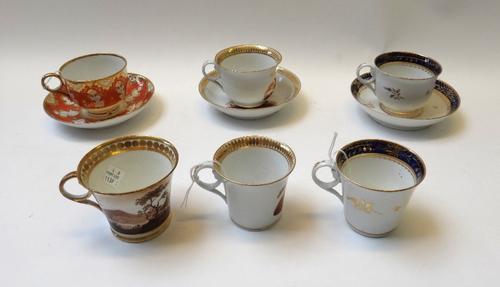 A Chamberlain Worcester trio, circa 1815, painted with sepia landscape vignettes inside gilt borders, pattern `450', together with another Chamberlain