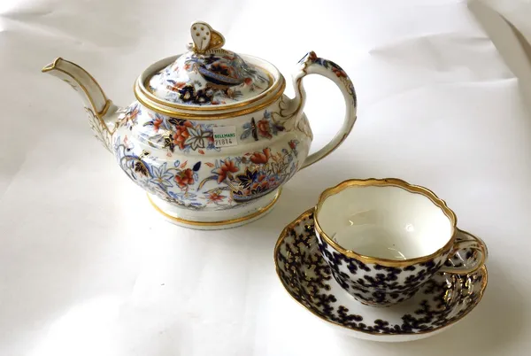 A group of Ridgway porcelain, 19th century, comprising; a teapot and cover, a trio, and matching Worcester plate, each decorated with a blue and gilt