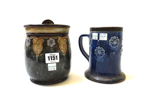 A Royal Doulton stoneware tobacco jar and cover of Art Nouveau design, early 20th century, foliate decorated against a mottled green ground, 15cm high