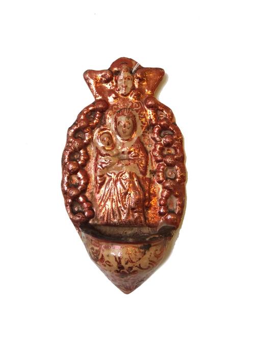 An Hispano Moresque lustre holy water stoup, probably Manises, 17th/18th century, moulded with the Madonna and child beneath a winged angel's head, pi