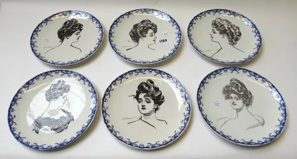 Six Royal Doulton 'Gibson Girl' plates, each decorated with a female portrait within a blue bow and heart border, together with a book by C.D. Gibson,