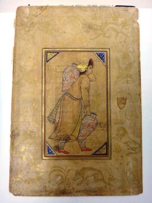 A youth carrying jars, Iran, 19th century, in ink with transparent pigments and gold on paper, standing carrying two jars, the borders illuminated wit