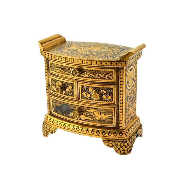 A Japanese miniature inlaid chest of drawers by the Komai company of Kyoto, 20th century, comprising of two short and two long drawers, decorated in s