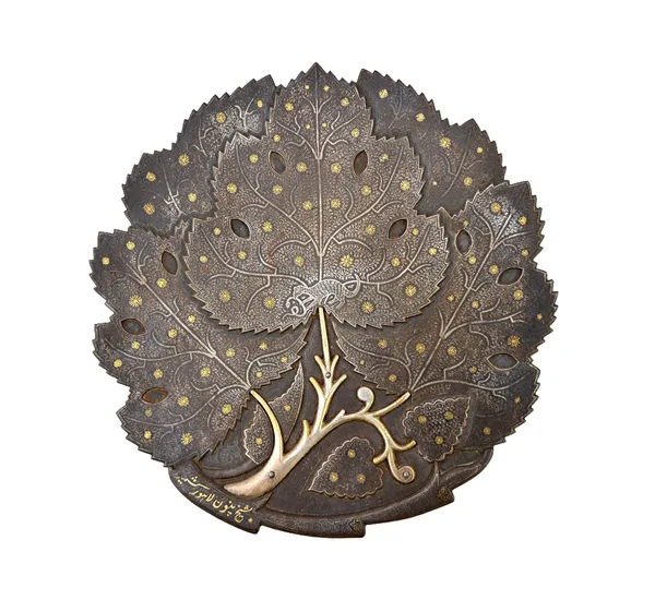 A damascened leaf shaped dish, probably North India, 19th century, formed as overlapping leaves, the centre inlaid with a mongoose holding a snake in