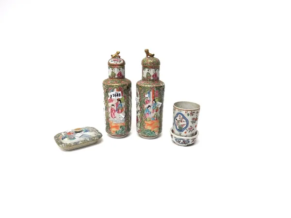 A pair of Canton famille-rose cylindrical vases and two covers, late 19th century, each painted with panels of figures and birds in branches, each app