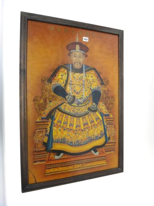 A Chinese reverse glass painting, probably 20th century, painted with a portrait of the Emperor Kangxi seated on a dragon throne wearing yellow dragon