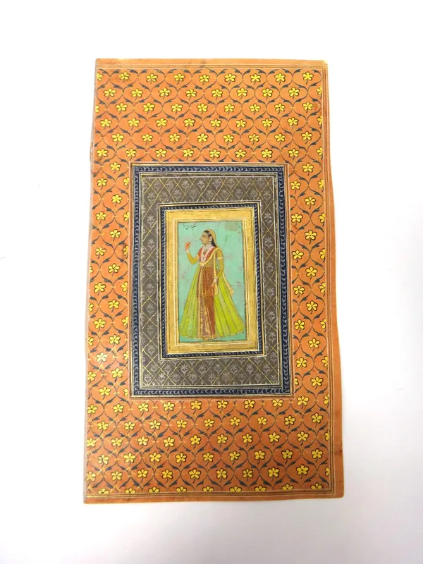 An album page; full length portrait of a lady, possibly Deccan, India, second half 18th century, opaque pigments heightened with gold on paper, standi