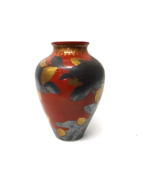 A Japanese porcelain vase, 20th century, of ovoid form, gilt and silvered  with fruiting branches beneath a gilt lappet border against a deep orange r