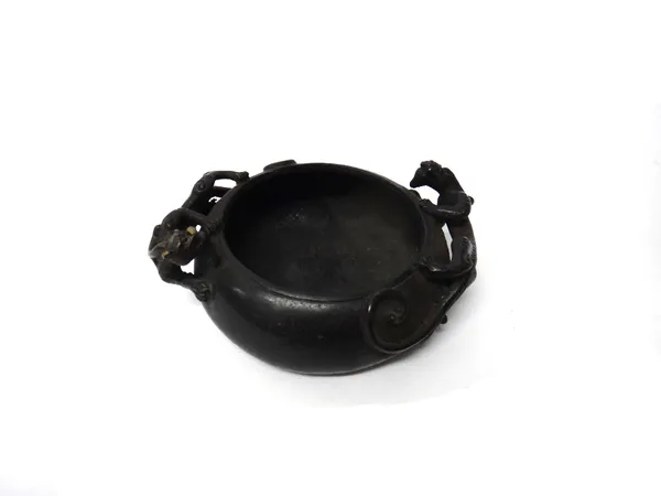 A Chinese bronze censer, 18th century, the compressed circular body applied with two chilong, the base signed Wu Bang Zuo zao, 11.7cm. diameter.