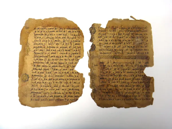Two folios from a Qur'an in Eastern kufic script, Iran, 12th century, Qur'an XLV (sura al- jathiya), v.23 to Qur'an XLVI (sura  al-naziyat ), v.31 Qur