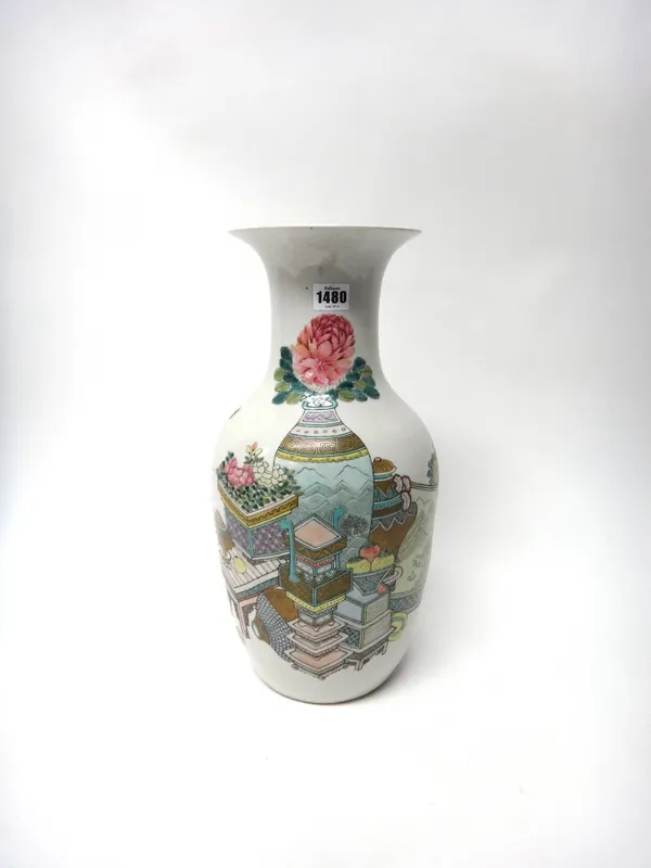 A Chinese famille rose baluster vase, 20th century, painted with tables, vases of flowers, a screen, a censer and fruit, the reverse with calligraphy