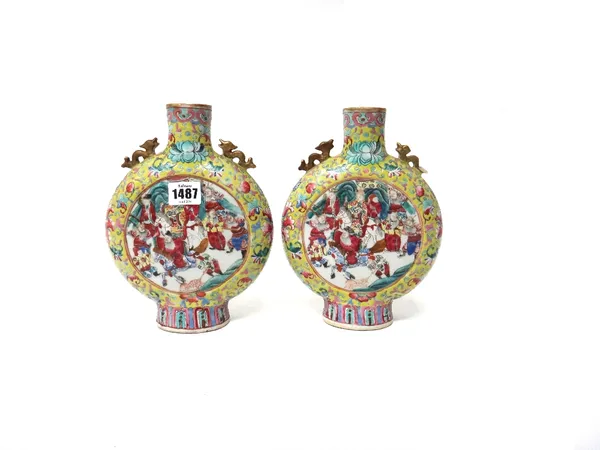 A pair of Chinese yellow ground famille rose moonflasks, late 19th century, each painted on one side with a figurative panel, the reverse painted with