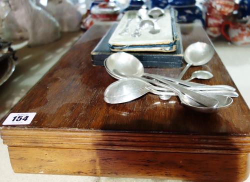 A cased silver knife, fork and spoon set, a group of silver-plated spoons and a cased canteen. (qty)