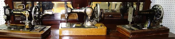 A group of three Singer sewing machines. (3)