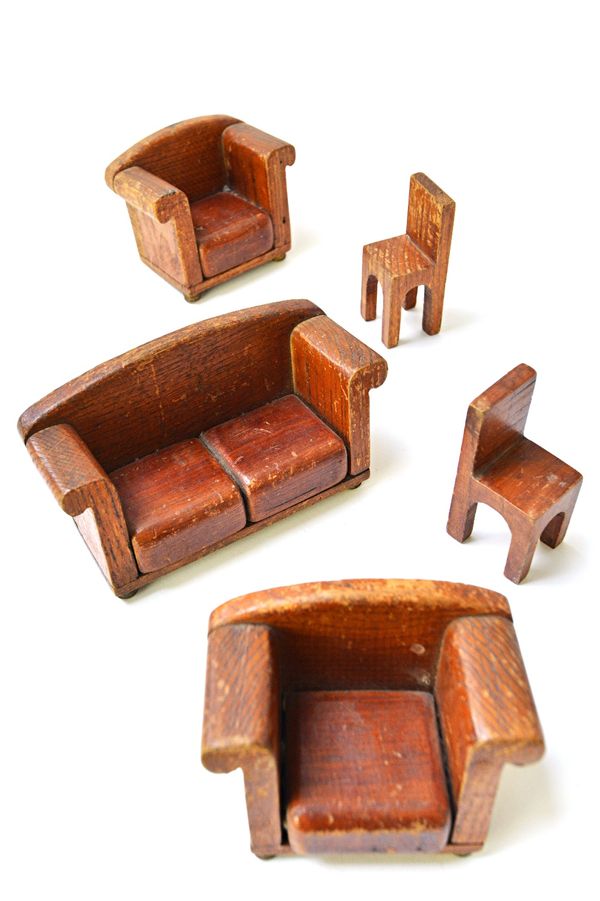 A suite of miniature 1930's style furniture, to include a sofa, 17cm wide, a pair of armchairs and two single chairs. (5)  Illustrated